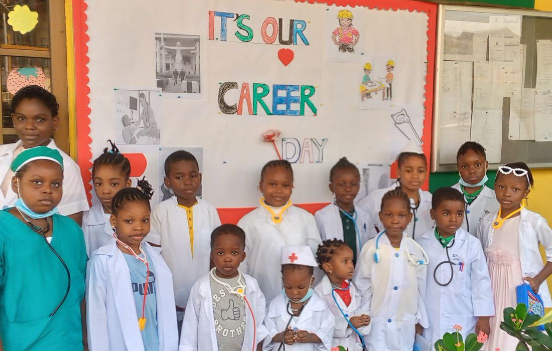 Career Day group photo in front of the classroom display board